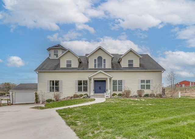 183 Twin Valley Trl, Cedar Grove, WI 53013 - cape cod home featuring a detached garage, a shingled roof, and a front lawn