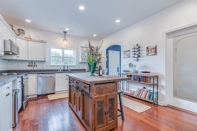 183 Twin Valley Trl, Cedar Grove, WI 53013 - kitchen with dark wood-style flooring, a sink, butcher block countertops, stainless steel appliances, and white cabinetry
