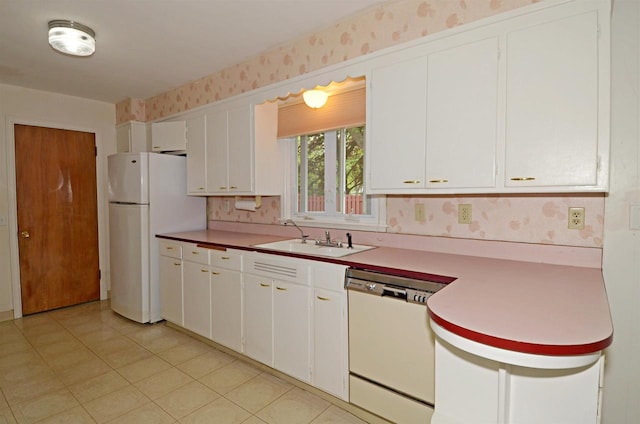 5109 Whitcomb Dr, Madison, WI 53711 - kitchen with white appliances, a sink, wallpapered walls, white cabinetry, and light countertops