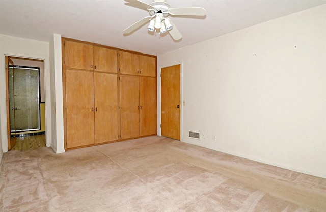 5109 Whitcomb Dr, Madison, WI 53711 - unfurnished bedroom featuring light carpet, a closet, and a ceiling fan
