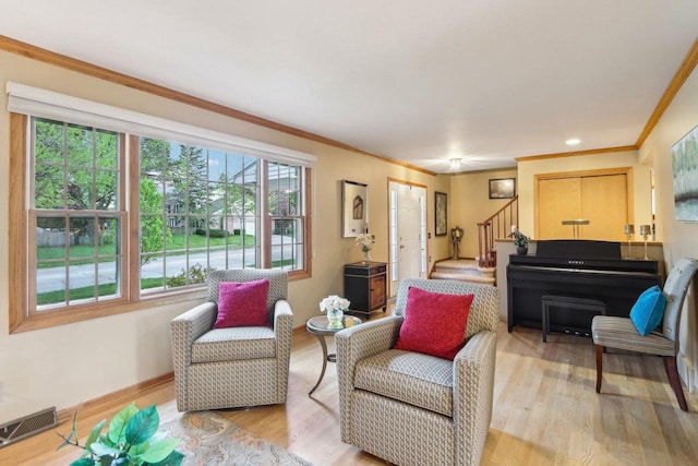 6614 Inner Dr, Madison, WI 53705 - living room with stairway, light wood-style floors, ornamental molding, and baseboards