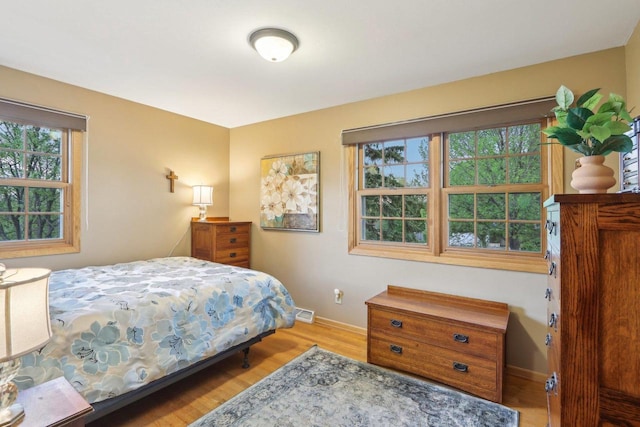 6614 Inner Dr, Madison, WI 53705 - bedroom featuring wood finished floors and baseboards