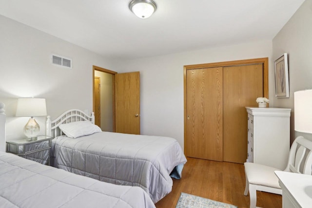 6614 Inner Dr, Madison, WI 53705 - bedroom with a closet and wood finished floors