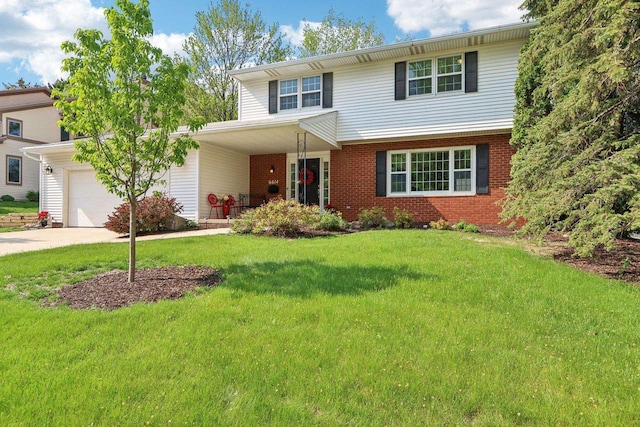 6614 Inner Dr, Madison, WI 53705 - view of front of home featuring a garage, a front lawn, concrete driveway, brick siding, and a porch