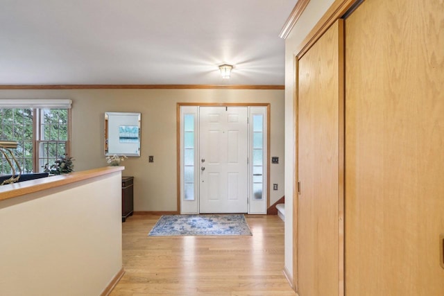 6614 Inner Dr, Madison, WI 53705 - foyer entrance featuring light wood-style floors, stairway, and ornamental molding