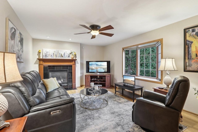 6614 Inner Dr, Madison, WI 53705 - living area with wood finished floors, ceiling fan, and a fireplace