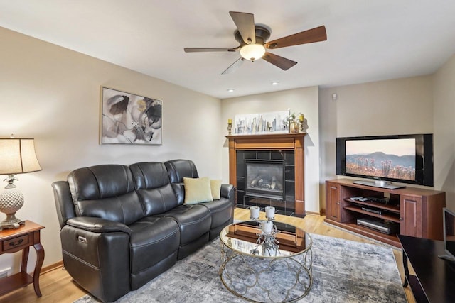 6614 Inner Dr, Madison, WI 53705 - living room with light wood finished floors, ceiling fan, and a fireplace