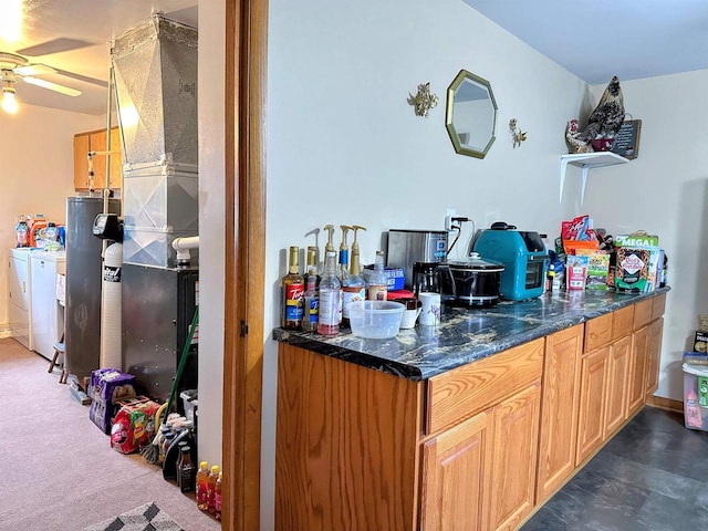 bar featuring separate washer and dryer, ceiling fan, and water heater