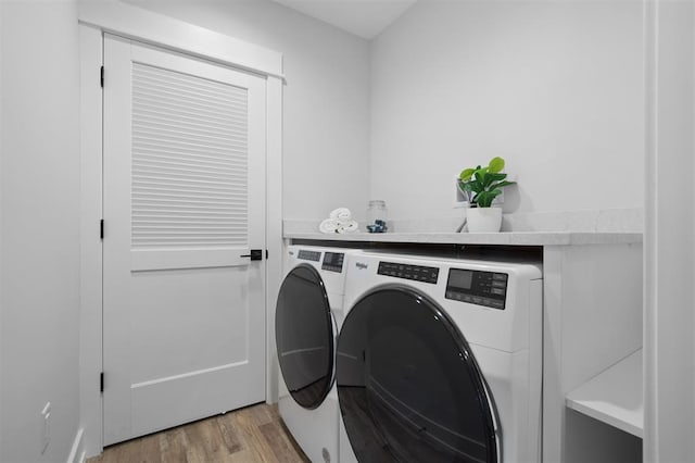 306 NW 3rd St, Monroe, WI 53566 - laundry area featuring laundry area, washer and clothes dryer, and light wood-style flooring