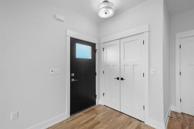 306 NW 3rd St, Monroe, WI 53566 - foyer entrance with baseboards and light wood finished floors