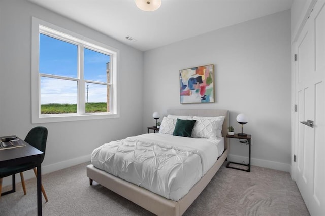 221 NW 3rd Ave, Monroe, WI 53566 - bedroom featuring baseboards, carpet flooring, and visible vents