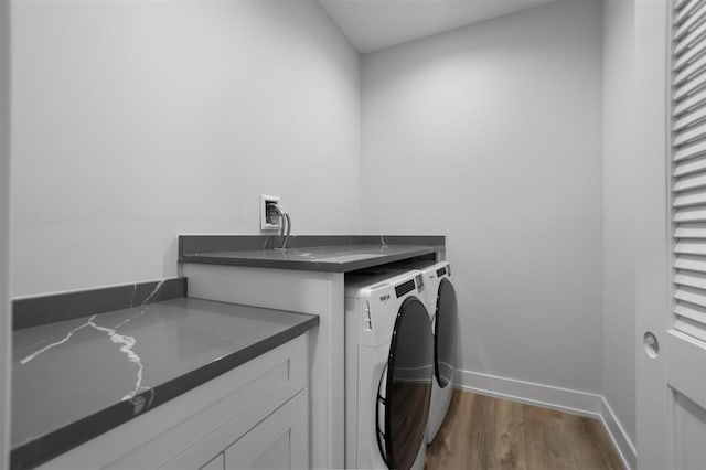 223 NW 3rd Ave, Monroe, WI 53566 - washroom with baseboards, laundry area, washer and clothes dryer, and dark wood-type flooring