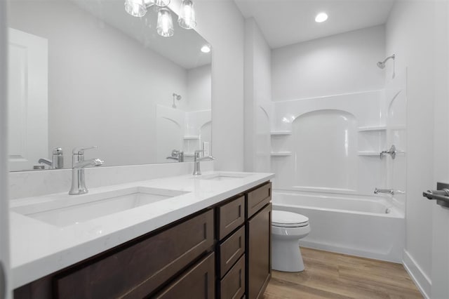 223 NW 3rd Ave, Monroe, WI 53566 - full bath featuring a sink, shower / bath combination, toilet, and wood finished floors
