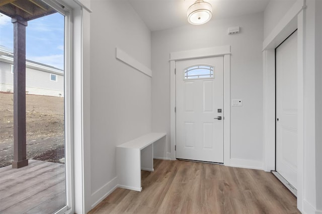 223 NW 3rd Ave, Monroe, WI 53566 - mudroom featuring baseboards and light wood finished floors