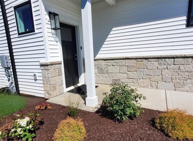 255 NW 3rd Ave, Monroe, WI 53566 - property entrance with stone siding