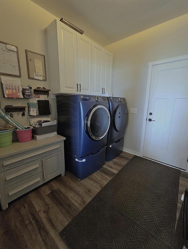 456 N Hyland St, Juneau, WI 53039 - washroom featuring washer and clothes dryer, dark wood-type flooring, and cabinet space