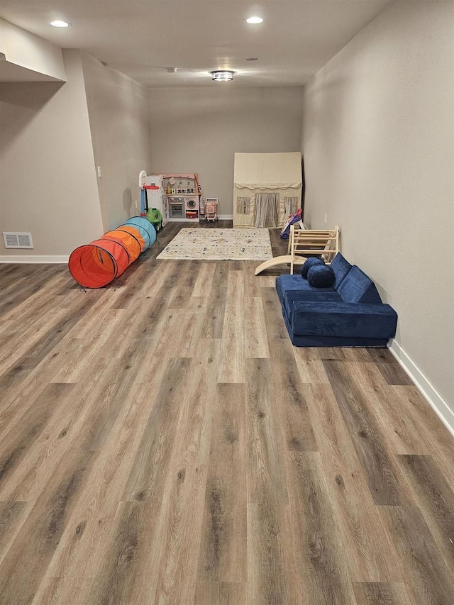 456 N Hyland St, Juneau, WI 53039 - game room featuring wood finished floors, recessed lighting, and baseboards