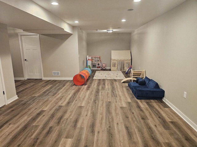 456 N Hyland St, Juneau, WI 53039 - recreation room with recessed lighting, wood finished floors, and baseboards