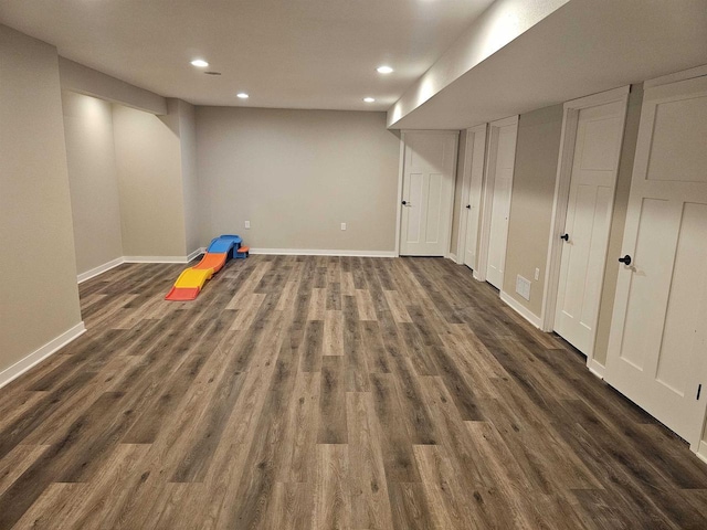 456 N Hyland St, Juneau, WI 53039 - finished below grade area featuring recessed lighting, dark wood-style flooring, and baseboards