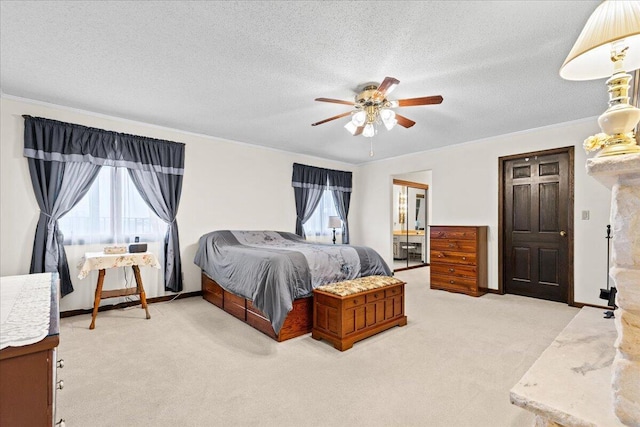 N84W16033 Menomonee Ave Unit 200, Menomonee Falls, WI 53051 - bedroom with multiple windows, light carpet, ornamental molding, ceiling fan, and a textured ceiling