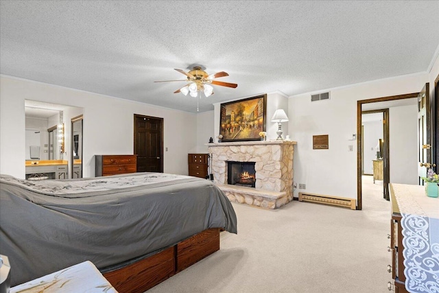 N84W16033 Menomonee Ave Unit 200, Menomonee Falls, WI 53051 - bedroom with carpet floors, a stone fireplace, crown molding, a textured ceiling, and ensuite bath