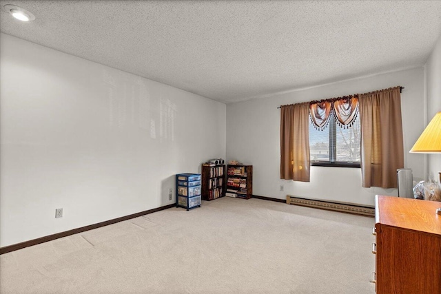 N84W16033 Menomonee Ave Unit 200, Menomonee Falls, WI 53051 - unfurnished room with a baseboard radiator, light carpet, and a textured ceiling