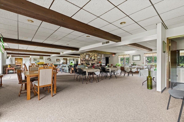 N84W16033 Menomonee Ave Unit 200, Menomonee Falls, WI 53051 - dining area with carpet floors, beam ceiling, and a paneled ceiling