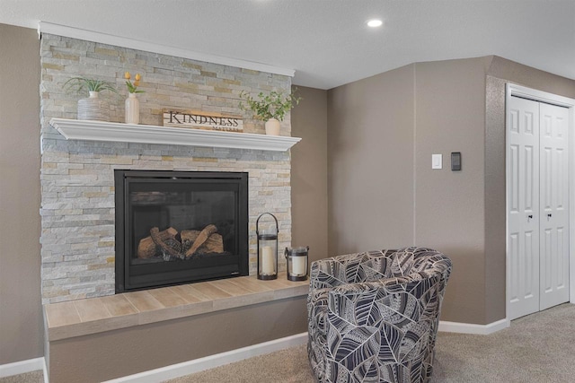 interior space with carpet flooring, baseboards, a fireplace, and recessed lighting