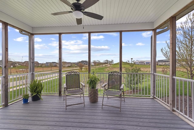 unfurnished sunroom with wooden ceiling, wood finished floors, and ceiling fan
