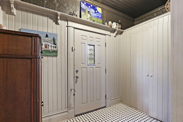 N1453 Clover Rd, Genoa City, WI 53128 - mudroom featuring crown molding, wooden walls, and tile patterned floors