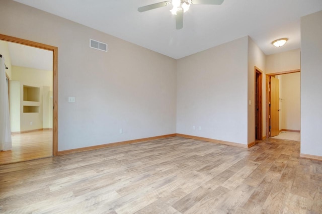 524 Tindalls Nest, Twin Lakes, WI 53181 - unfurnished room featuring baseboards, ceiling fan, light wood finished floors, and visible vents