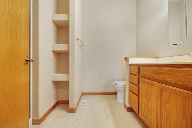 524 Tindalls Nest, Twin Lakes, WI 53181 - bathroom featuring tile patterned flooring, visible vents, vanity, toilet, and baseboards