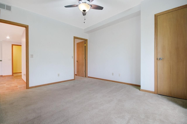 524 Tindalls Nest, Twin Lakes, WI 53181 - unfurnished bedroom with a ceiling fan, baseboards, visible vents, and light carpet
