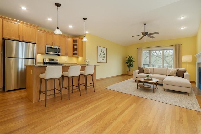 524 Tindalls Nest, Twin Lakes, WI 53181 - living area featuring a fireplace, light wood-type flooring, recessed lighting, a ceiling fan, and vaulted ceiling