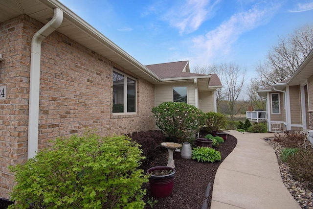 524 Tindalls Nest, Twin Lakes, WI 53181 - view of side of home featuring brick siding and a shingled roof
