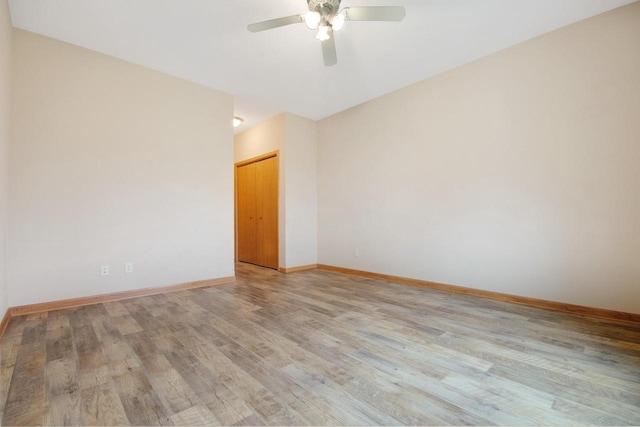 524 Tindalls Nest, Twin Lakes, WI 53181 - spare room with baseboards, a ceiling fan, and light wood-style flooring
