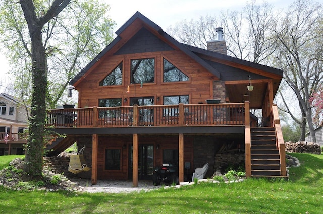 3024 Nagawicka Ave, Delafield, WI 53018 - rear view of house with stairway, a deck, a chimney, and a yard