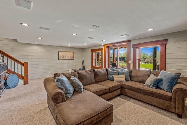 3024 Nagawicka Ave, Delafield, WI 53018 - carpeted living area featuring recessed lighting, wooden walls, and stairs