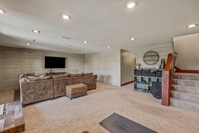 3024 Nagawicka Ave, Delafield, WI 53018 - living area featuring carpet flooring, wood walls, stairway, and recessed lighting