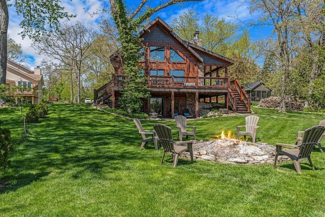 3024 Nagawicka Ave, Delafield, WI 53018 - back of house with stairs, an outdoor fire pit, a wooden deck, and a chimney
