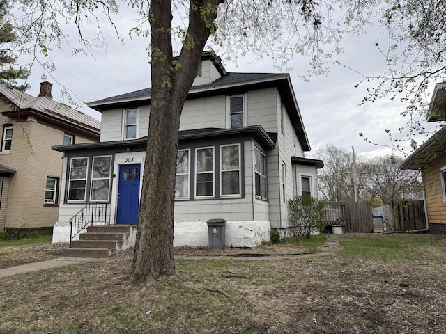 view of front of property with fence and entry steps