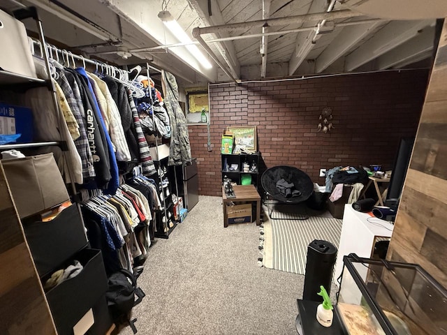 walk in closet with carpet flooring