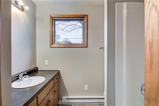 208 W Grand Ave, Chippewa Falls, WI 54729 - bathroom with a baseboard heating unit and vanity