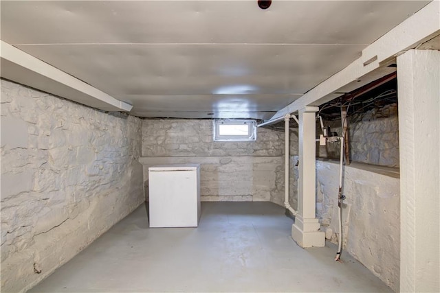 208 W Grand Ave, Chippewa Falls, WI 54729 - basement with fridge