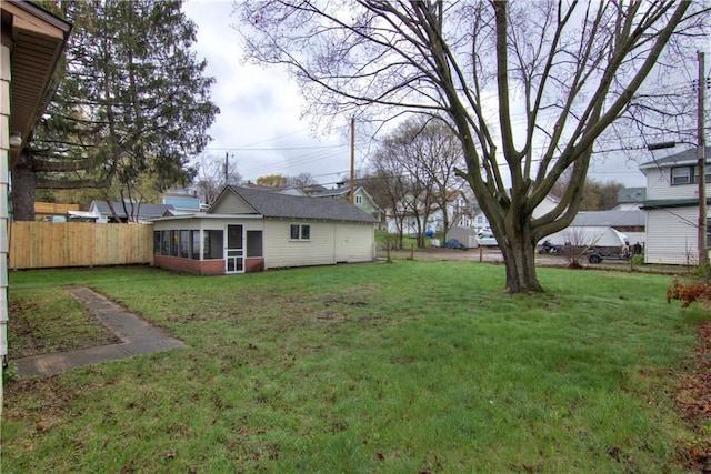 208 W Grand Ave, Chippewa Falls, WI 54729 - view of yard featuring a sunroom and fence