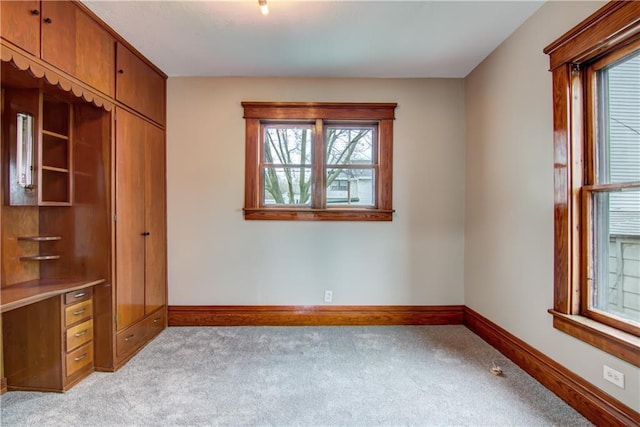 208 W Grand Ave, Chippewa Falls, WI 54729 - unfurnished bedroom with baseboards and light carpet