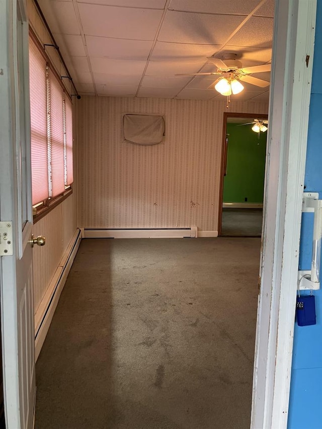 365 Jenkynsville Rd, Benton, WI 53803 - empty room with a baseboard radiator, a paneled ceiling, and ceiling fan