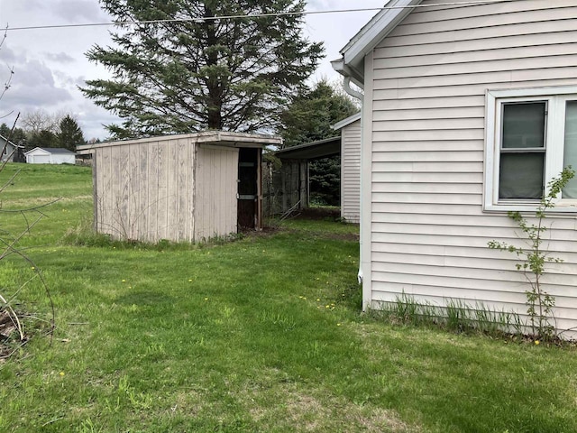 365 Jenkynsville Rd, Benton, WI 53803 - view of yard with a storage unit and an outbuilding