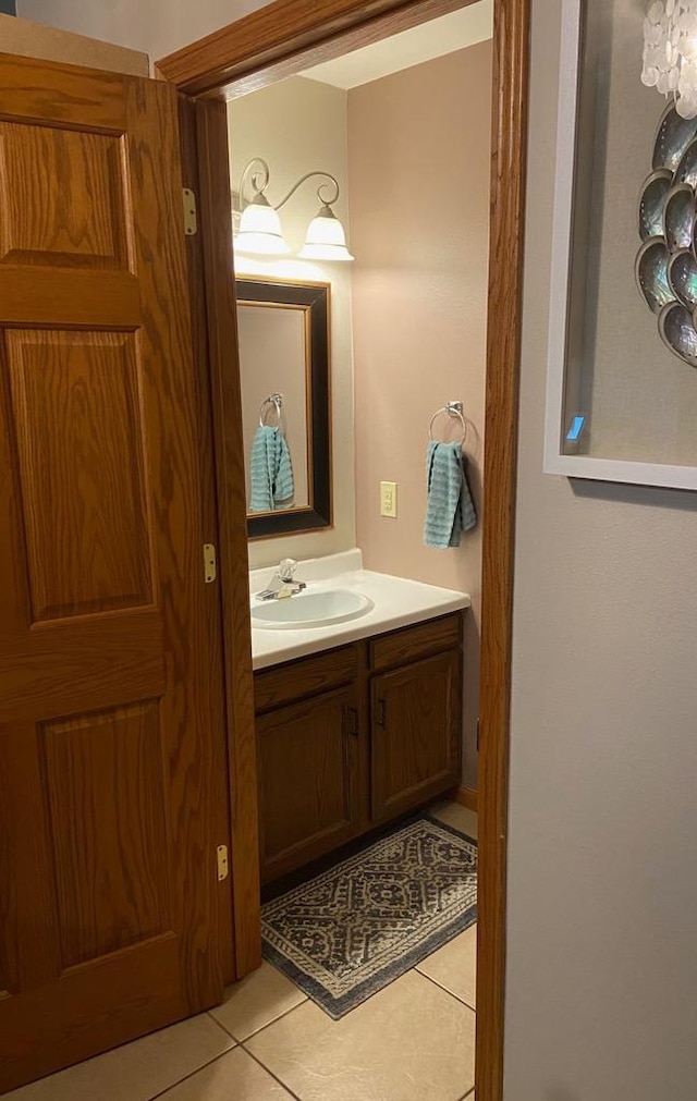 bathroom with tile patterned flooring and vanity
