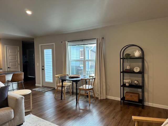 1817 Ridgewood Cir, Menomonie, WI 54751 - sitting room with dark wood-style floors, baseboards, lofted ceiling, and recessed lighting